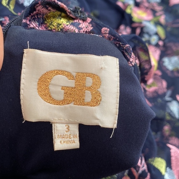 GB formal gown in navy with embroidered pink, yellow, and blue flowers. - Picture 10 of 15